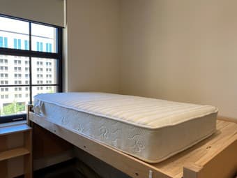 Two twin size mattresses and a bed frame 1