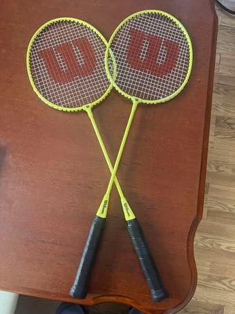 a set of two badminton rackets， badminton and net 1