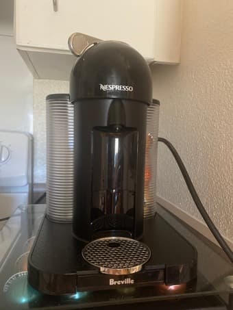 Nespresso Vertuo coffee machine w/ capsules and storage 1
