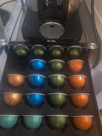 Nespresso Vertuo coffee machine w/ capsules and storage 2