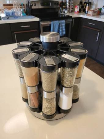 Revolving kitchen spice rack with double-ended spice jars 1