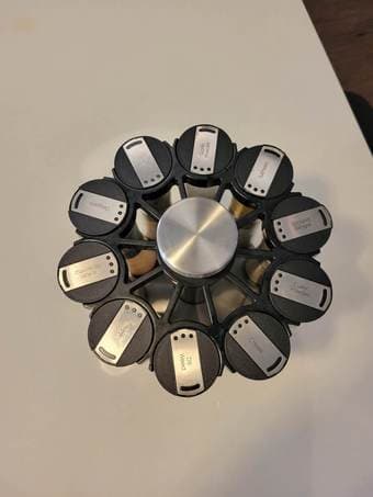 Revolving kitchen spice rack with double-ended spice jars 2