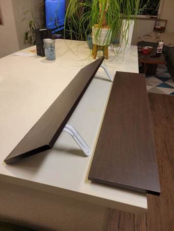 Two 3 ft x 8 in wood laminate wall shelves 2