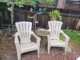 some outdoor furniture - chairs, bird bath, bird feeders 1