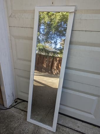 Mirror with attachable over-the-door hanger 1