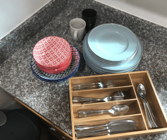 set of west elm plates, bowls and cutlery 1