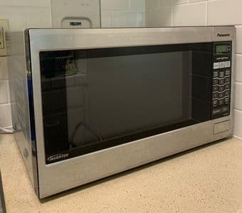 Moving Sale - TV, Microwave, books, couch cover, gaming chair, plants 2