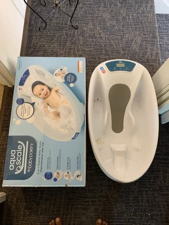 Baby bath tub with weighing and temperature feature 1