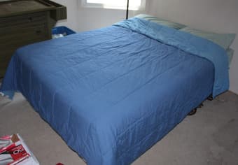 Double bed, chest of drawers, containters and books 1