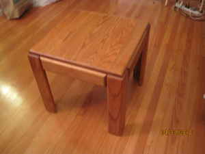 Small solid wood corner table - $30 1