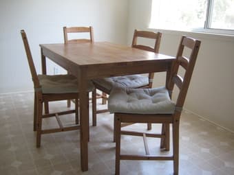 IKEA wood table + 4 chairs w/ cushions $110 1