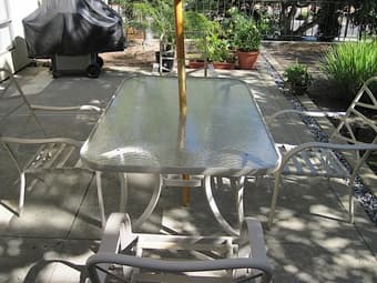 Glass patio table and 4 chairs  180$ 1