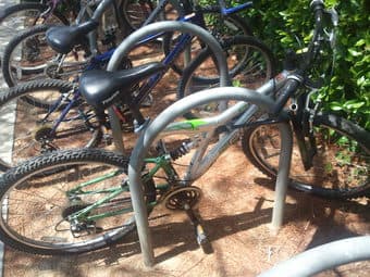 Triax adult mtn bike, silver/green, works fine, with lock $90 1