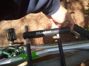 Triax adult mtn bike, silver/green, works fine, with lock $90 2
