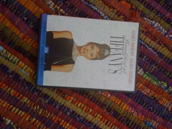 storage bins, framed Van Gogh poster, Breakfast at Tiffany's DVD 3