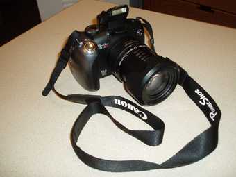 Canon Powershot SX10IS 10MP Digital Camera with 20x Wide Angle 1